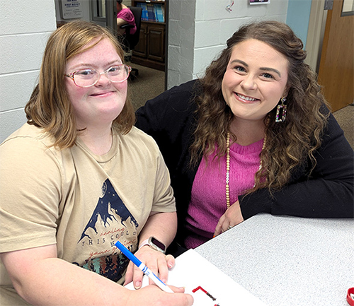 Sarah Jaynes working with a student
