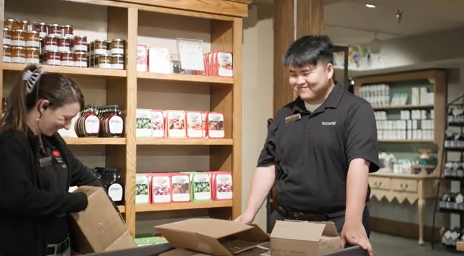 Sam enjoys helping stock the inventory.